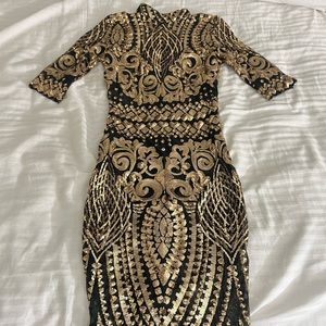Black and gold sequin dress